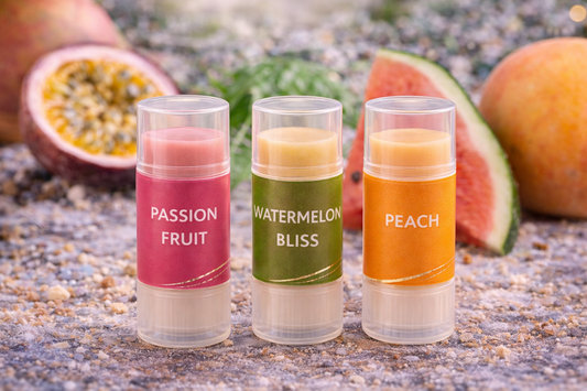 Three lip balm tubes labeled 'Passion Fruit', 'Watermelon Splash', and 'Peach Nectar' with fruit in the background.